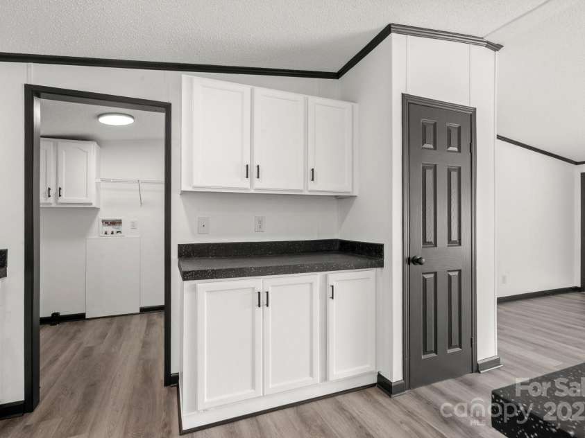 5810 NC Highway 66 Highway, King, NC 27021.  MLS# CAR4287311, YatesRealty ID 31106. Kitchen with utility entrance