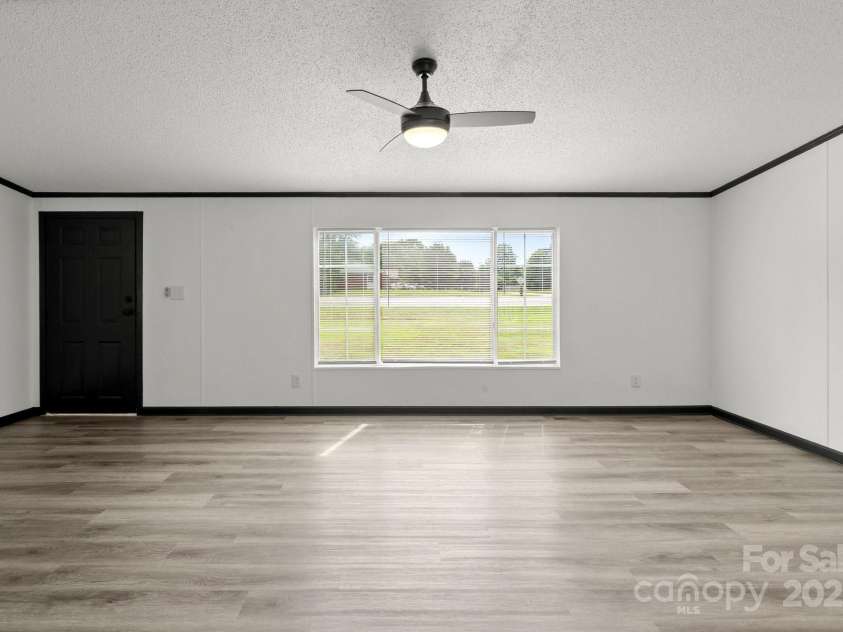 5810 NC Highway 66 Highway, King, NC 27021.  MLS# CAR4287311, YatesRealty ID 31106. Living room