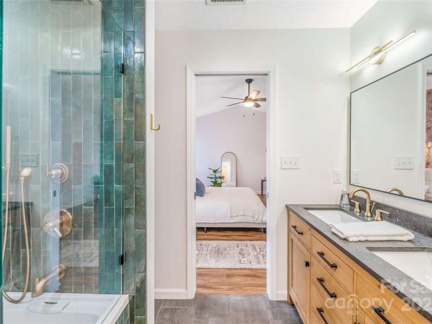 45 Heather Mist Drive, Weaverville, NC 28787.  MLS# CAR4282171, YatesRealty ID 31108. Double vanity and extra linen storage (behind shower).