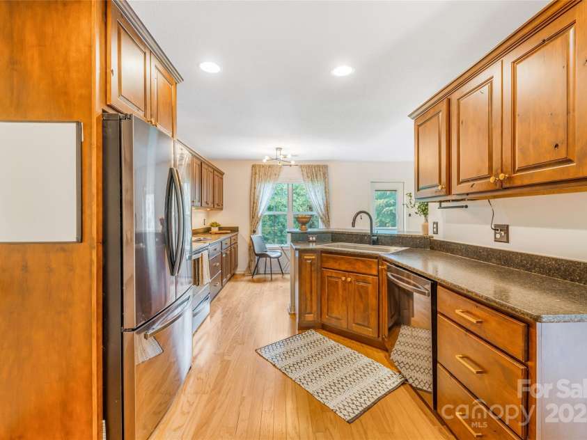 45 Heather Mist Drive, Weaverville, NC 28787.  MLS# CAR4282171, YatesRealty ID 31108. Great storage in cabinetry and breakfast bar ope to living room