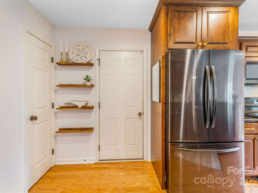 45 Heather Mist Drive, Weaverville, NC 28787.  MLS# CAR4282171, YatesRealty ID 31108. Kitchen includes door to garage, broom/storage closet as well as large pantry.