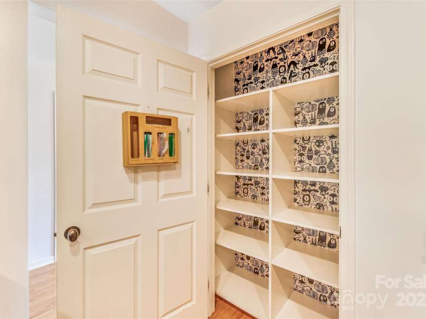 45 Heather Mist Drive, Weaverville, NC 28787.  MLS# CAR4282171, YatesRealty ID 31108. Pantry with peek a boo wall paper!