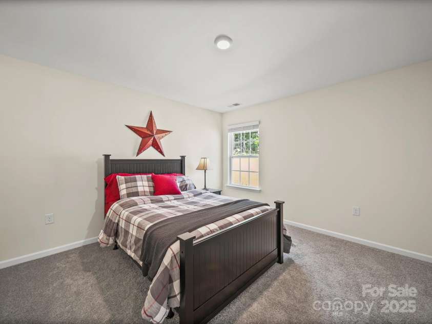 404 Saddlebred Lane, Locust, NC 28097.  MLS# CAR4275640, YatesRealty ID 31109. Bedroom 3 with walk in closet