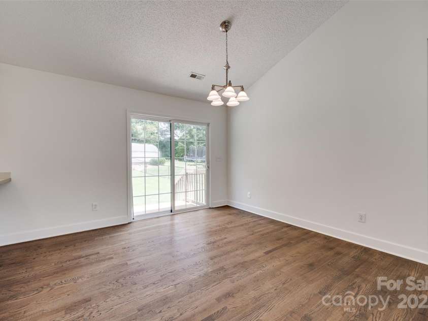 605 Summey Farm Drive, Dallas, NC 28034.  MLS# CAR4249509, YatesRealty ID 31112. Dining Area Leading to Back Patio