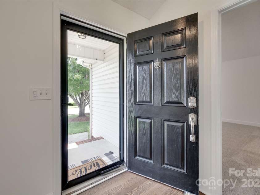 605 Summey Farm Drive, Dallas, NC 28034.  MLS# CAR4249509, YatesRealty ID 31112. Storm Door at Front Entry