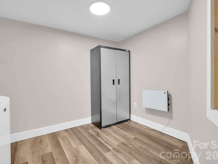 119 Beechwood Lane, Beech Mountain, NC 28604.  MLS# CAR4412496, YatesRealty ID 31115. Laundry Room with Storage Cabinet