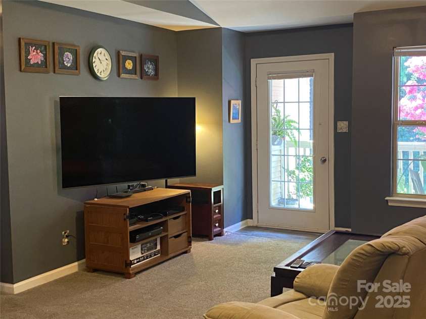 7224 Michaels Landing Drive, Charlotte, NC 28262.  MLS# CAR4283823, YatesRealty ID 31120. Family room opens to Balcony