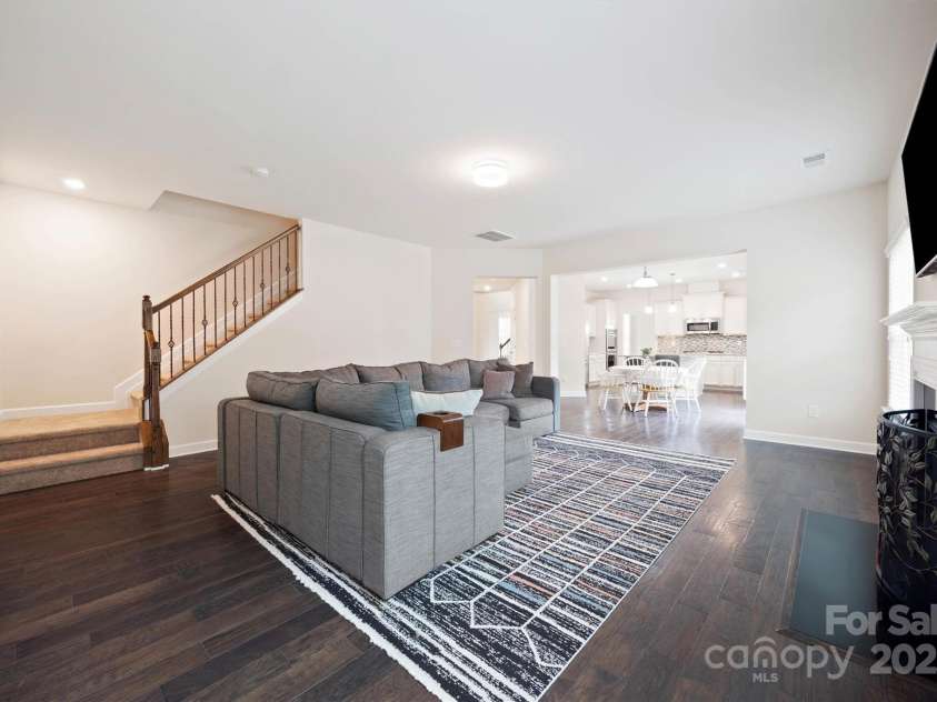 16928 Alydar Commons Lane, Charlotte, NC 28278.  MLS# CAR4289485, YatesRealty ID 31124. Great room with rear staircase