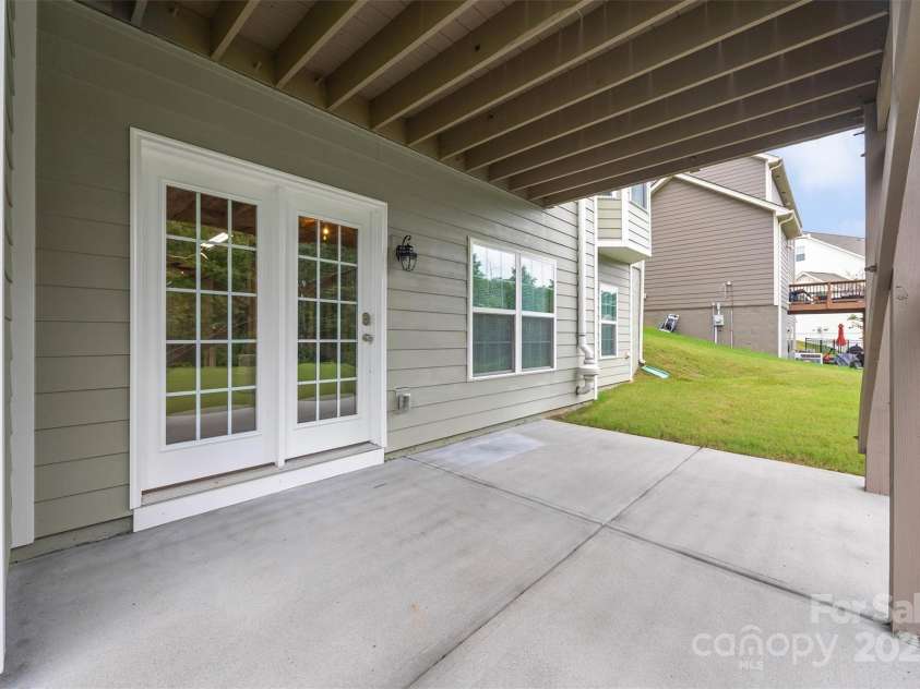16928 Alydar Commons Lane, Charlotte, NC 28278.  MLS# CAR4289485, YatesRealty ID 31124. Patio off walk-out basement