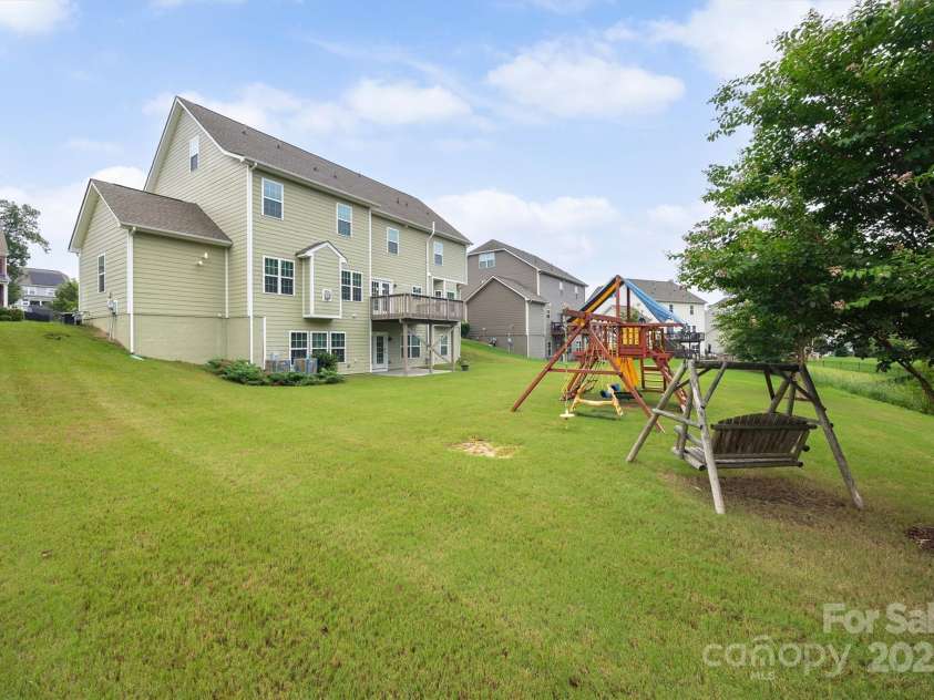 16928 Alydar Commons Lane, Charlotte, NC 28278.  MLS# CAR4289485, YatesRealty ID 31124. Rear of home with walk-out basement and private yard