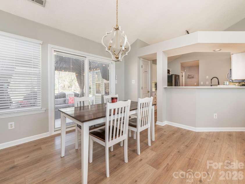 3930 Huntmeadow Drive, Charlotte, NC 28269.  MLS# CAR4387063, YatesRealty ID 31125. Serving window from kitchen to dining area and living room