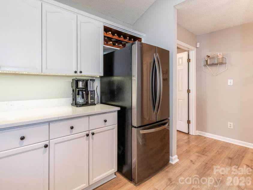 3930 Huntmeadow Drive, Charlotte, NC 28269.  MLS# CAR4387063, YatesRealty ID 31125. Stainless steel refrigerator with built-in wine storage above