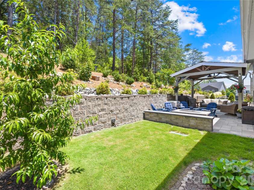 1368 Cedardale Lane, Denver, NC 28037.  MLS# CAR4391395, YatesRealty ID 31129. Backyard Looking towards Covered Rear Patio and Firepit Seating Area