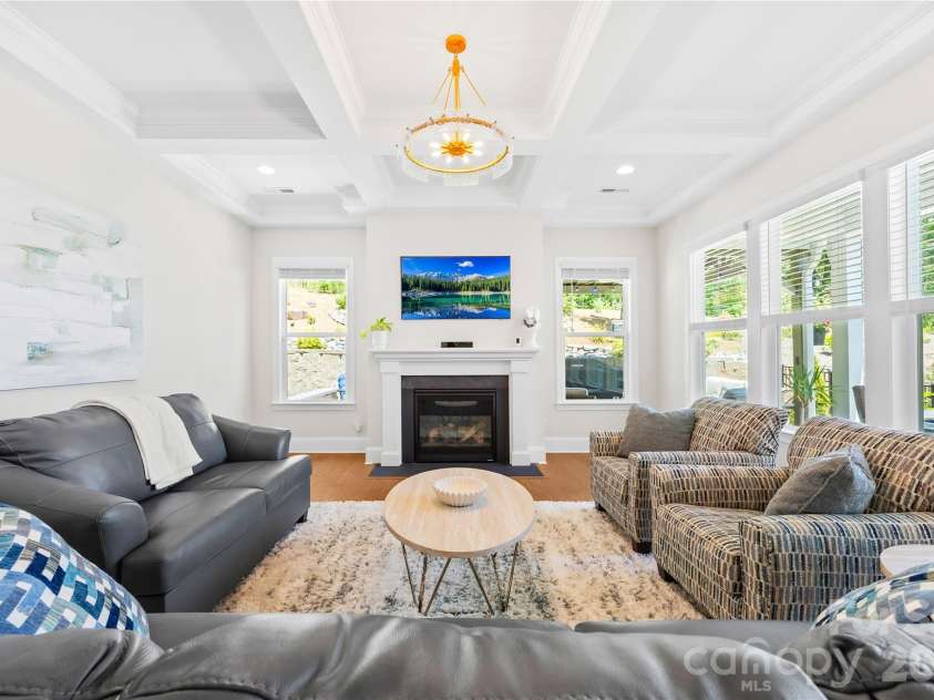 1368 Cedardale Lane, Denver, NC 28037.  MLS# CAR4391395, YatesRealty ID 31129. Living Room with Cofferred Ceiling and Fireplace