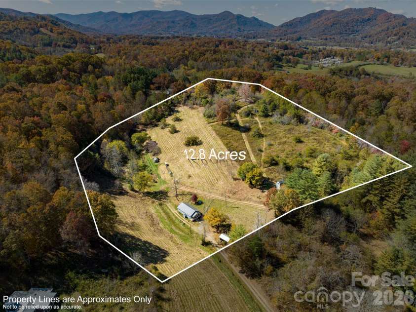 70 Vintage Place, Canton, NC 28716.  MLS# CAR4363944, YatesRealty ID 31132. 12.8 acre homestead with multiple buildings.