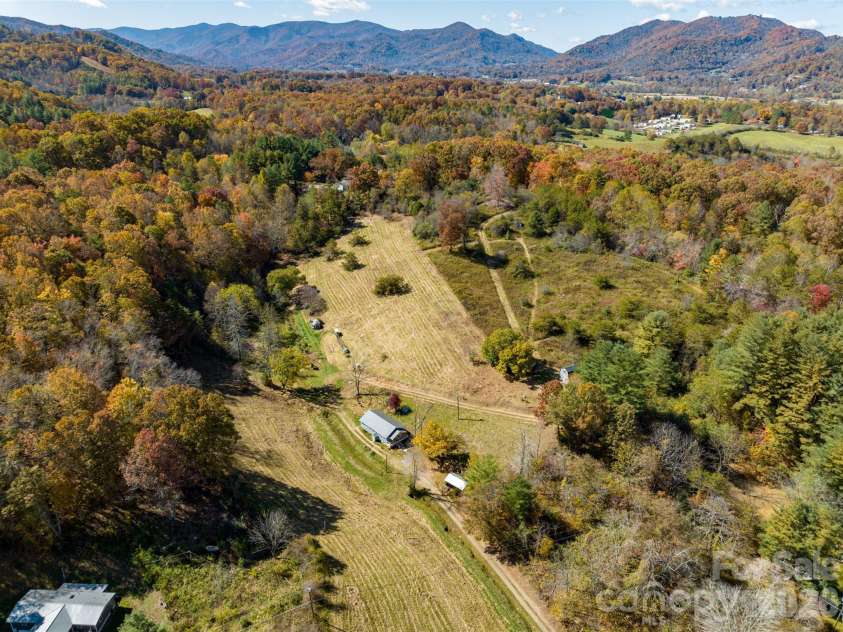 70 Vintage Place, Canton, NC 28716.  MLS# CAR4363944, YatesRealty ID 31132. 12.8 acre homestead with multiple buildings.