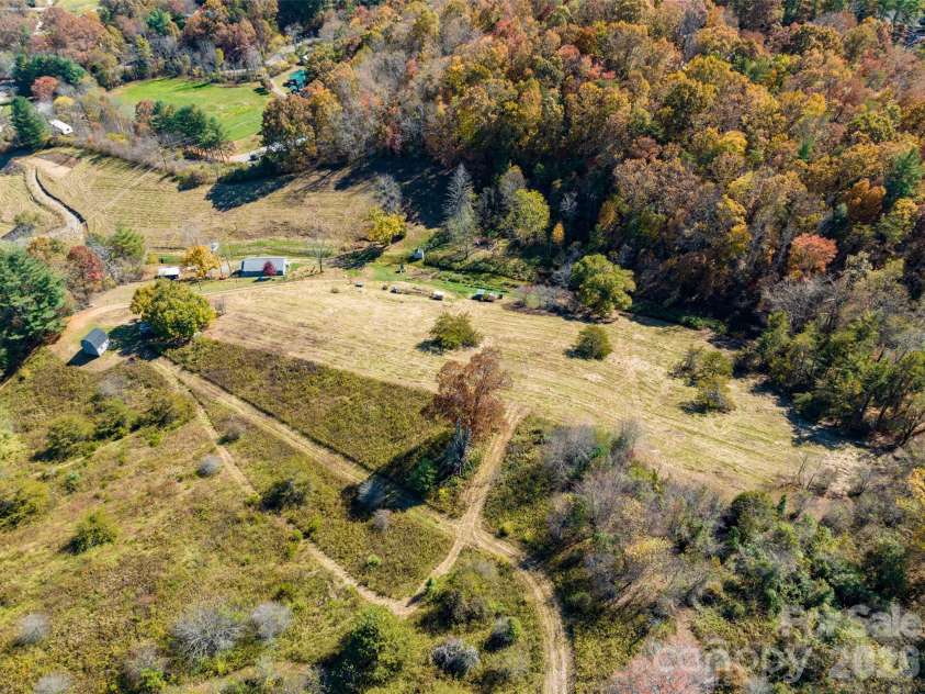 70 Vintage Place, Canton, NC 28716.  MLS# CAR4363944, YatesRealty ID 31132. 12.8 acre homestead with multiple buildings.