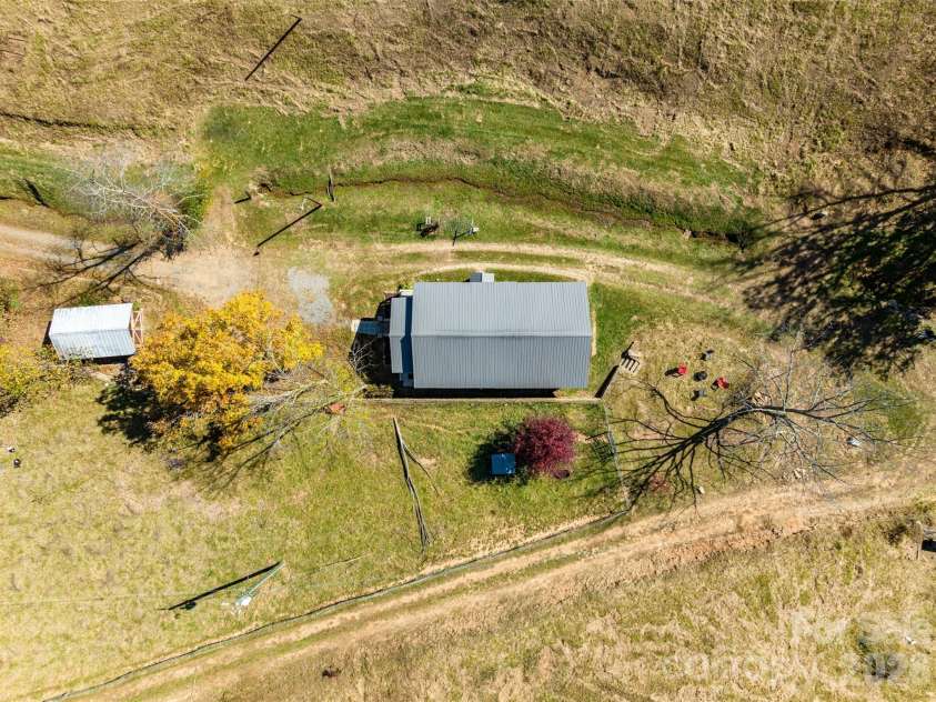 70 Vintage Place, Canton, NC 28716.  MLS# CAR4363944, YatesRealty ID 31132. View of home and shed