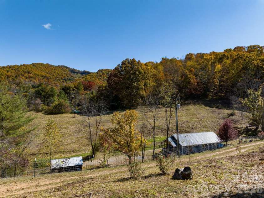 70 Vintage Place, Canton, NC 28716.  MLS# CAR4363944, YatesRealty ID 31132. View of home and shed