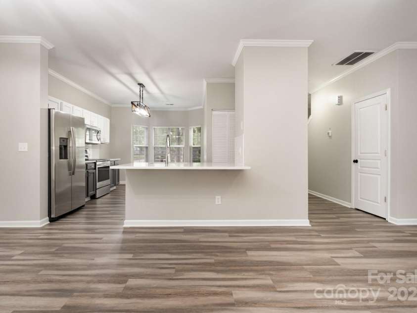 10974 Heritage Green Drive, Cornelius, NC 28031.  MLS# CAR4282858, YatesRealty ID 31134. Kitchen Opens up to family area