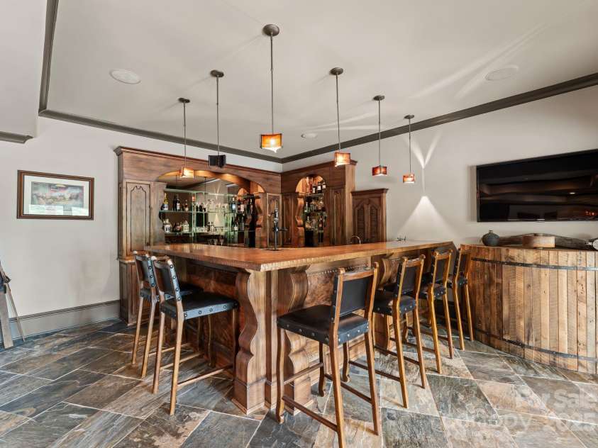 172 Tennessee Circle, Mooresville, NC 28117.  MLS# CAR4252701, YatesRealty ID 3115. Lower-Level Bar is fully equipped with dual dishwashers, beverage fridge, icemaker, soda dispenser, and extensive storage.