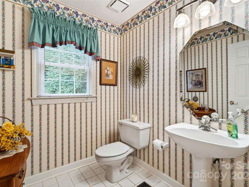 19 Moriah Lane, Asheville, NC 28803.  MLS# CAR4277964, YatesRealty ID 31150. Main level 1/2 bathroom