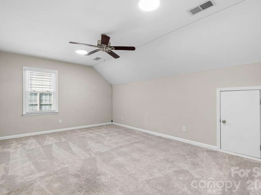 19942 Scanmar Lane, Cornelius, NC 28031.  MLS# CAR4381771, YatesRealty ID 31153. Bedroom 2. Room over garage. Large space with extra storage areas.