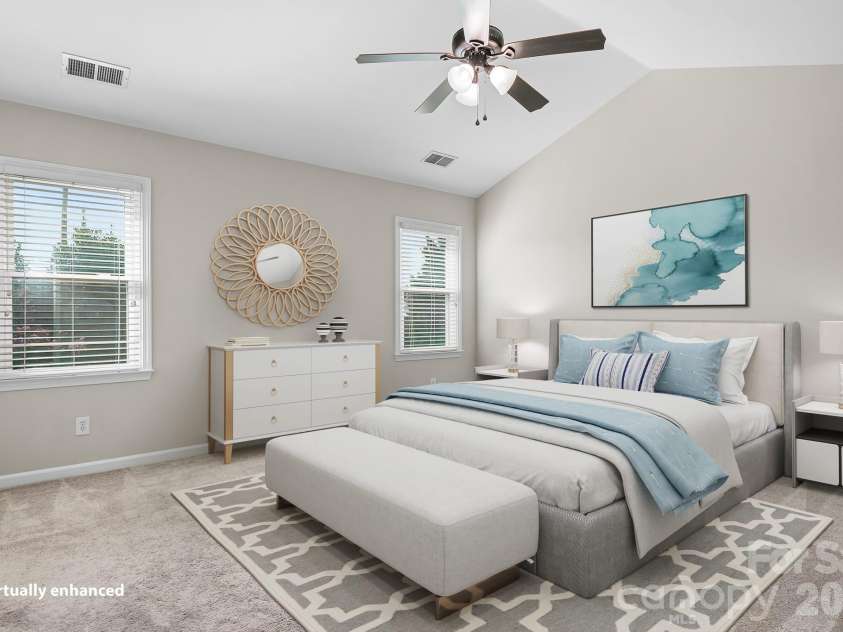 19942 Scanmar Lane, Cornelius, NC 28031.  MLS# CAR4381771, YatesRealty ID 31153. Digitally Enhanced Primary Bedroom. Angled Ceilings with Ceiling Fan. Walk in Closet.