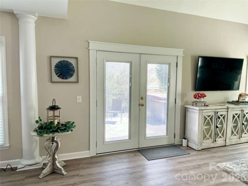 19942 Scanmar Lane, Cornelius, NC 28031.  MLS# CAR4381771, YatesRealty ID 31153. Double doors from the family room to the back patio area