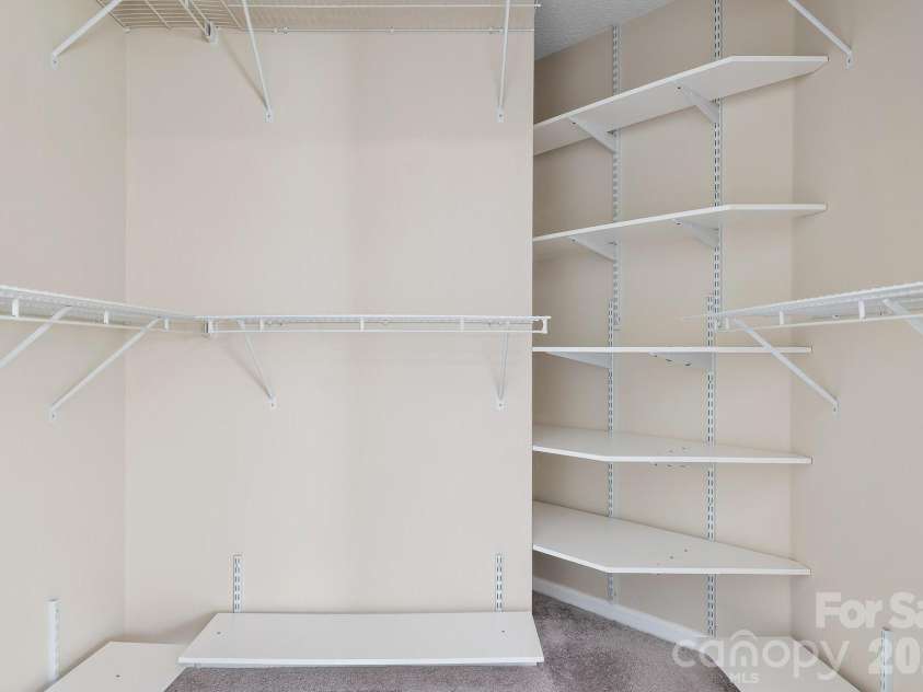 19942 Scanmar Lane, Cornelius, NC 28031.  MLS# CAR4381771, YatesRealty ID 31153. Walk In closet with shelving