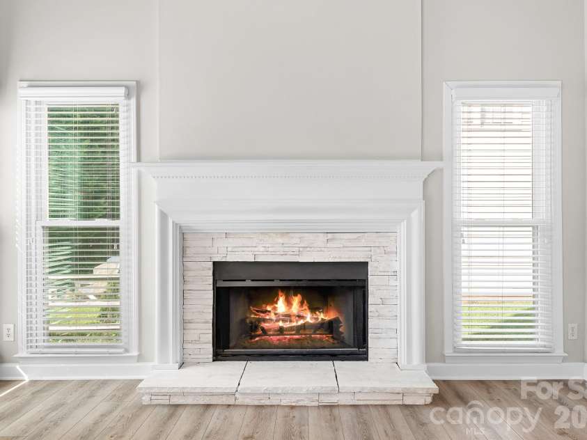 19942 Scanmar Lane, Cornelius, NC 28031.  MLS# CAR4381771, YatesRealty ID 31153. Wood Burning Fireplace. Side Windows for lots of light!