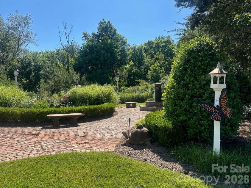 17718 Morehampton Avenue, Cornelius, NC 28031.  MLS# CAR4389501, YatesRealty ID 31154. Butterfly and bird garden