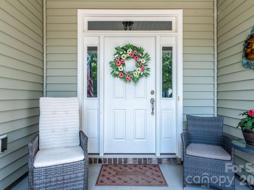 17718 Morehampton Avenue, Cornelius, NC 28031.  MLS# CAR4389501, YatesRealty ID 31154. Front porch seating!