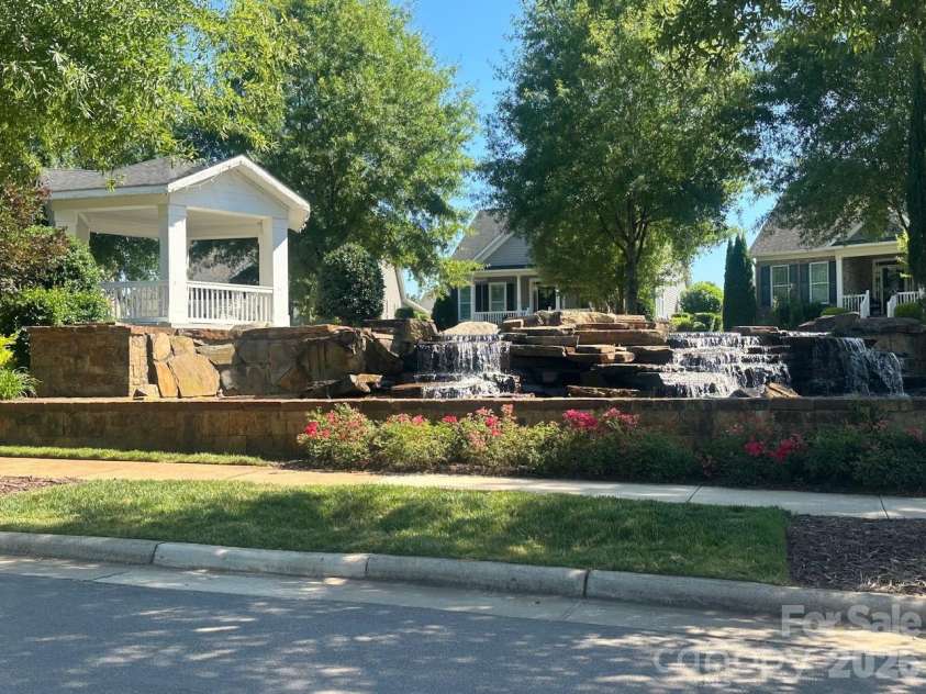 17718 Morehampton Avenue, Cornelius, NC 28031.  MLS# CAR4389501, YatesRealty ID 31154. Gazebo and water fall