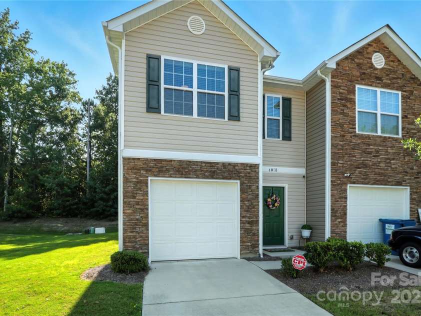6018 Guildford Hill Lane, Charlotte, NC 28215.  MLS# CAR4287147, YatesRealty ID 31154. End-unit with stone details, private garage, and spacious side yard for extra privacy.End-unit with stone details, private garage, and spacious side yard for extra privacy.End-unit townhome featuring stone-accente