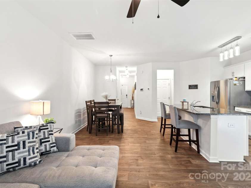 6018 Guildford Hill Lane, Charlotte, NC 28215.  MLS# CAR4287147, YatesRealty ID 31154. Open layout allows the living room, kitchen, and dining room to connect seamlessly.