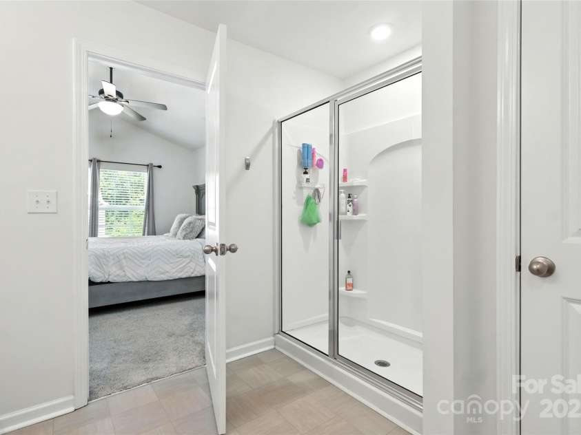 6018 Guildford Hill Lane, Charlotte, NC 28215.  MLS# CAR4287147, YatesRealty ID 31154. Owner's suite bath also features walk-shower and a closet for additional storage and convenience.