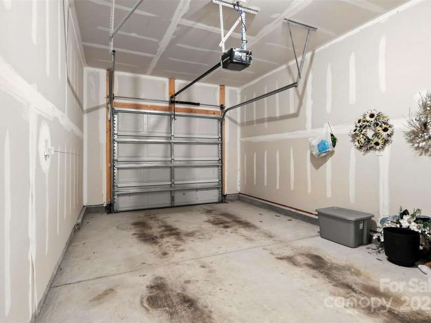6018 Guildford Hill Lane, Charlotte, NC 28215.  MLS# CAR4287147, YatesRealty ID 31154. Single car garage ideal for parking your vehicle or use as a dedicated storage space.