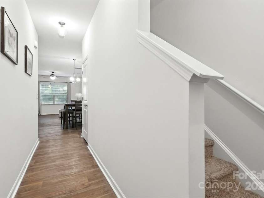 6018 Guildford Hill Lane, Charlotte, NC 28215.  MLS# CAR4287147, YatesRealty ID 31154. Welcoming entry way with wood-style flooring that flows throughout the main level.