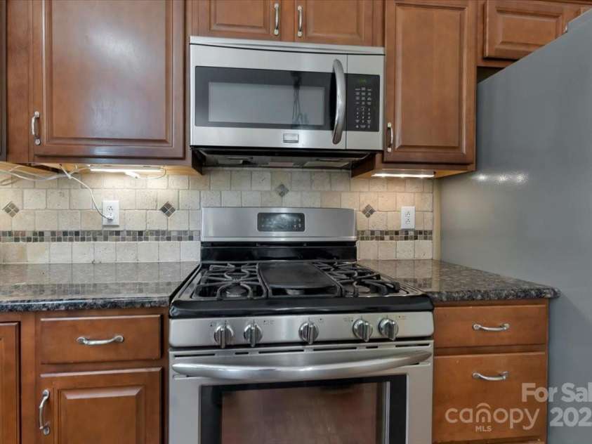 1524 Candlewyck Court, Kannapolis, NC 28081.  MLS# CAR4279653, YatesRealty ID 31163. Kitchen with stainless steel appliances