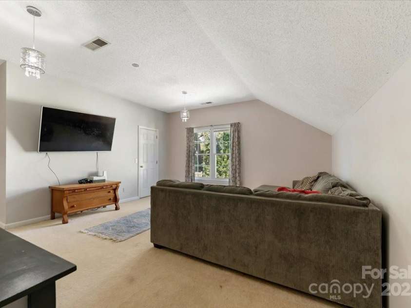 1524 Candlewyck Court, Kannapolis, NC 28081.  MLS# CAR4279653, YatesRealty ID 31163. Spacious 4th bedroom or bonus room on the second floor featuring a walk-in closet and convenient attic access.