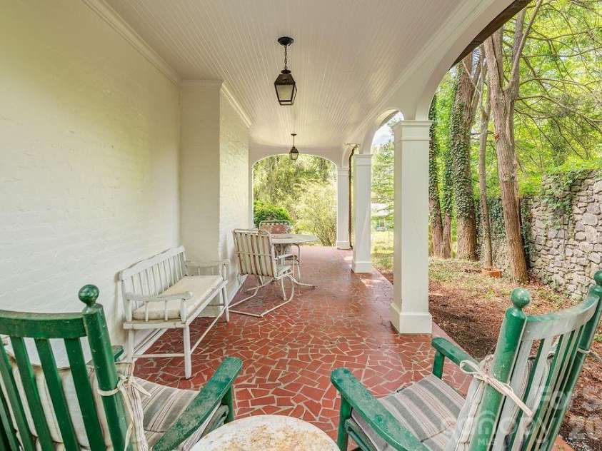 88 Bear Creek Road, Asheville, NC 28806.  MLS# CAR4373598, YatesRealty ID 31166. Tiled porch veranda adds old world charm.