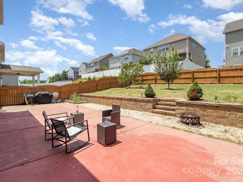 6211 Canyon Trail, Denver, NC 28037.  MLS# CAR4277710, YatesRealty ID 31180. Backyard with apple and peach trees