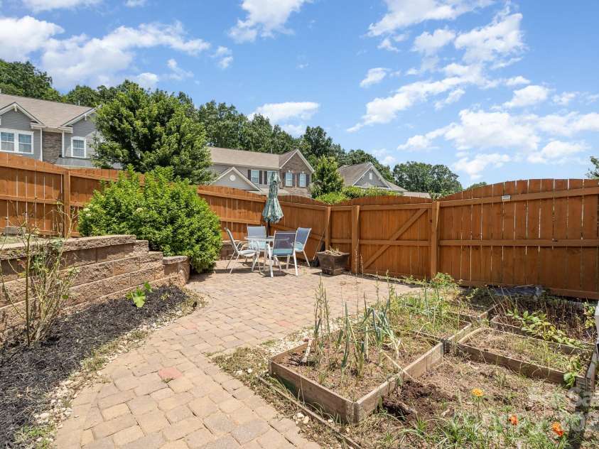 6211 Canyon Trail, Denver, NC 28037.  MLS# CAR4277710, YatesRealty ID 31180. Stone patio and garden