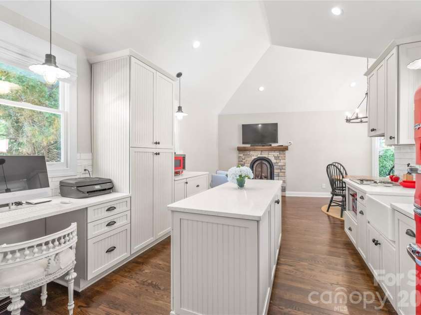 25017 Stonekirk Lane, Fort Mill, SC 29707.  MLS# CAR4383231, YatesRealty ID 31182. Fully equipped for complete independence, this second kitchen features a versatile mobile island that adapts seamlessly to your changing needs for cooking or entertaining.