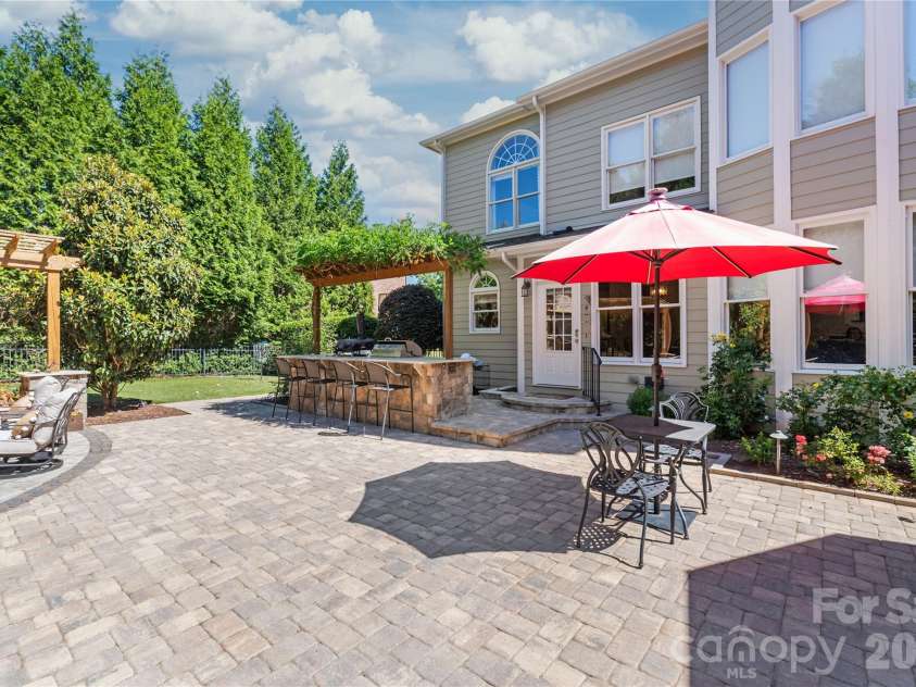 25017 Stonekirk Lane, Fort Mill, SC 29707.  MLS# CAR4383231, YatesRealty ID 31182. With a backyard this massive, the scale is unmatched...offering so many different vantage points and beautiful views to take in whether you're grilling, dining, or lounging.