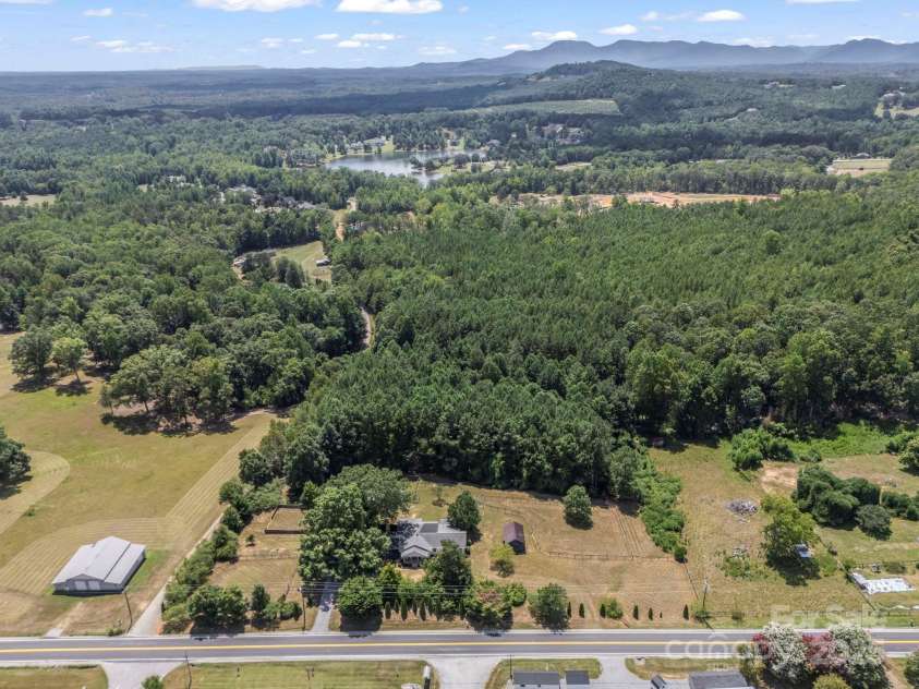 5990 Nc 9 Highway, Tryon, NC 28782.  MLS# CAR4281496, YatesRealty ID 31184. Great location with remodeled home, multiple structures and additional blockwork for maybe whatever your heart desires... another living space, a barn, whatever... check it out!