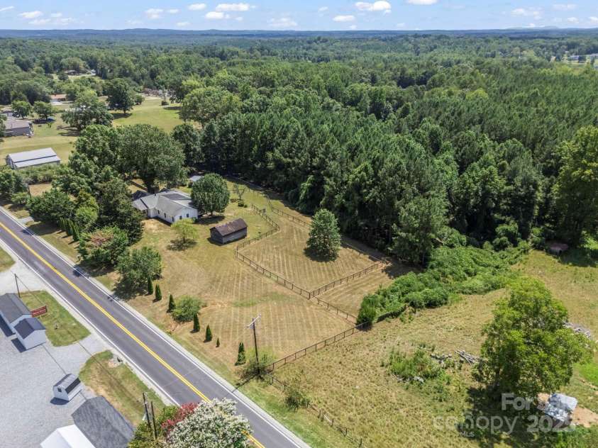 5990 Nc 9 Highway, Tryon, NC 28782.  MLS# CAR4281496, YatesRealty ID 31184. Great location with remodeled home, multiple structures and additional blockwork for maybe whatever your heart desires... another living space, a barn, whatever... check it out!