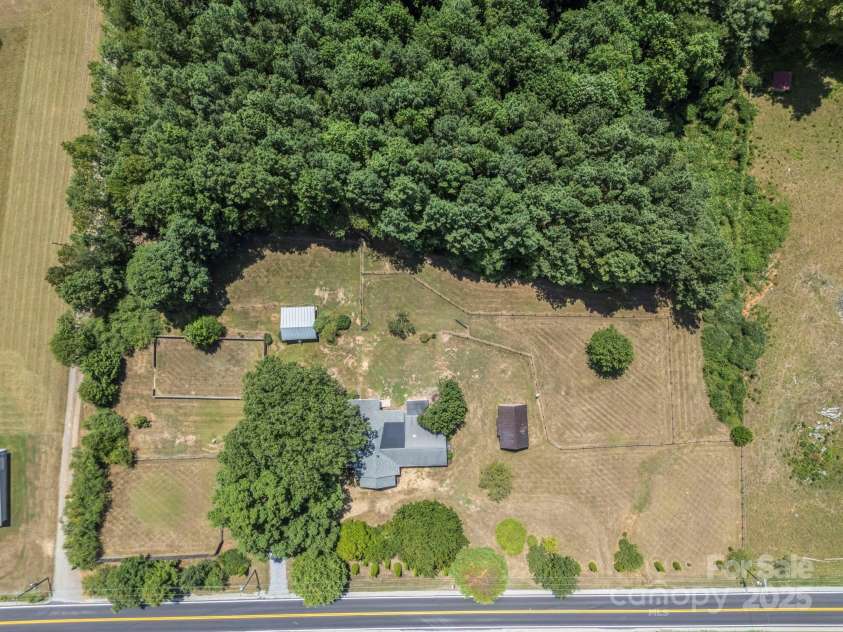 5990 Nc 9 Highway, Tryon, NC 28782.  MLS# CAR4281496, YatesRealty ID 31184. Great location with remodeled home, multiple structures and additional blockwork for maybe whatever your heart desires... another living space, a barn, whatever... check it out!