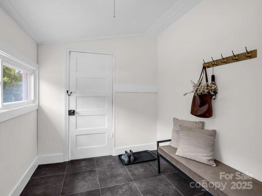 5990 Nc 9 Highway, Tryon, NC 28782.  MLS# CAR4281496, YatesRealty ID 31184. Mudroom from back